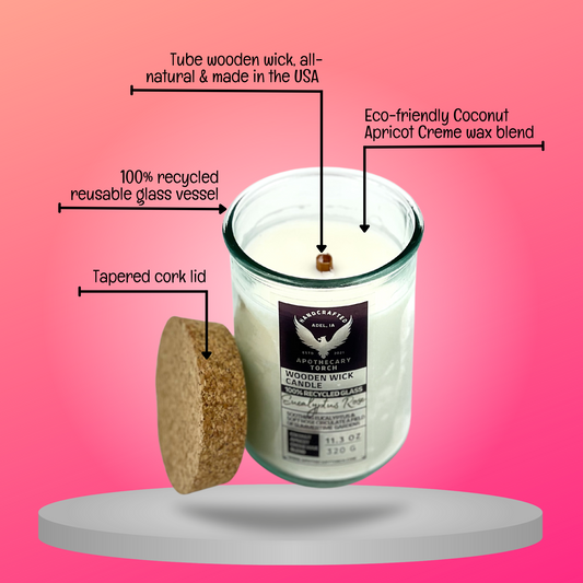 Eucalyptus Rose wooden wick candle with descriptive arrows pointing to the eco-friendly coconut apricot creme wax blend, the tube wooden wick that's all natural and made in the USA, an arrow pointing to the 100% recycled reusable glass vessel, and identifying arrow to the tapered cork lid.